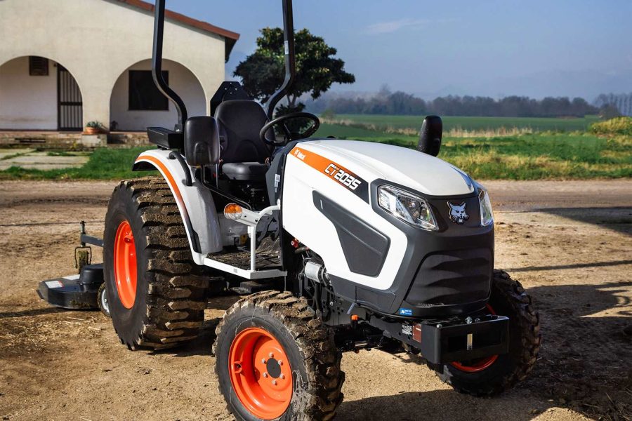 Compact tractor parked on rural farm property